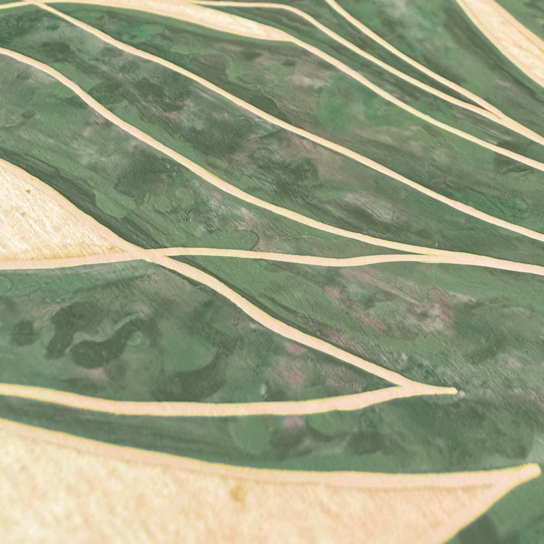 Close-up of a green marbled acrylic paint agave on wood panel.