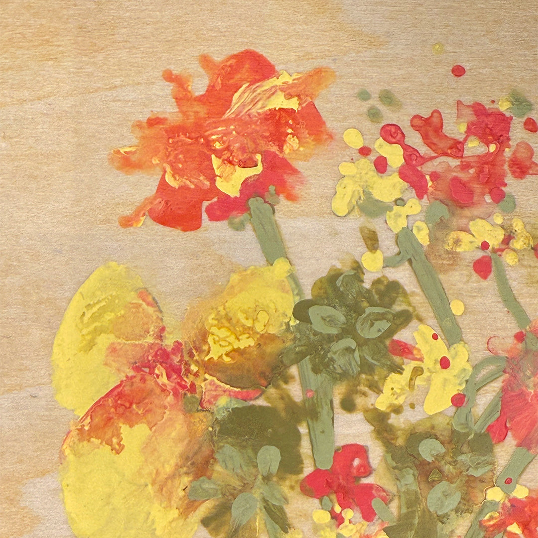 Artistic depiction of flowers with red, yellow, and green colors on a authentic wood background.