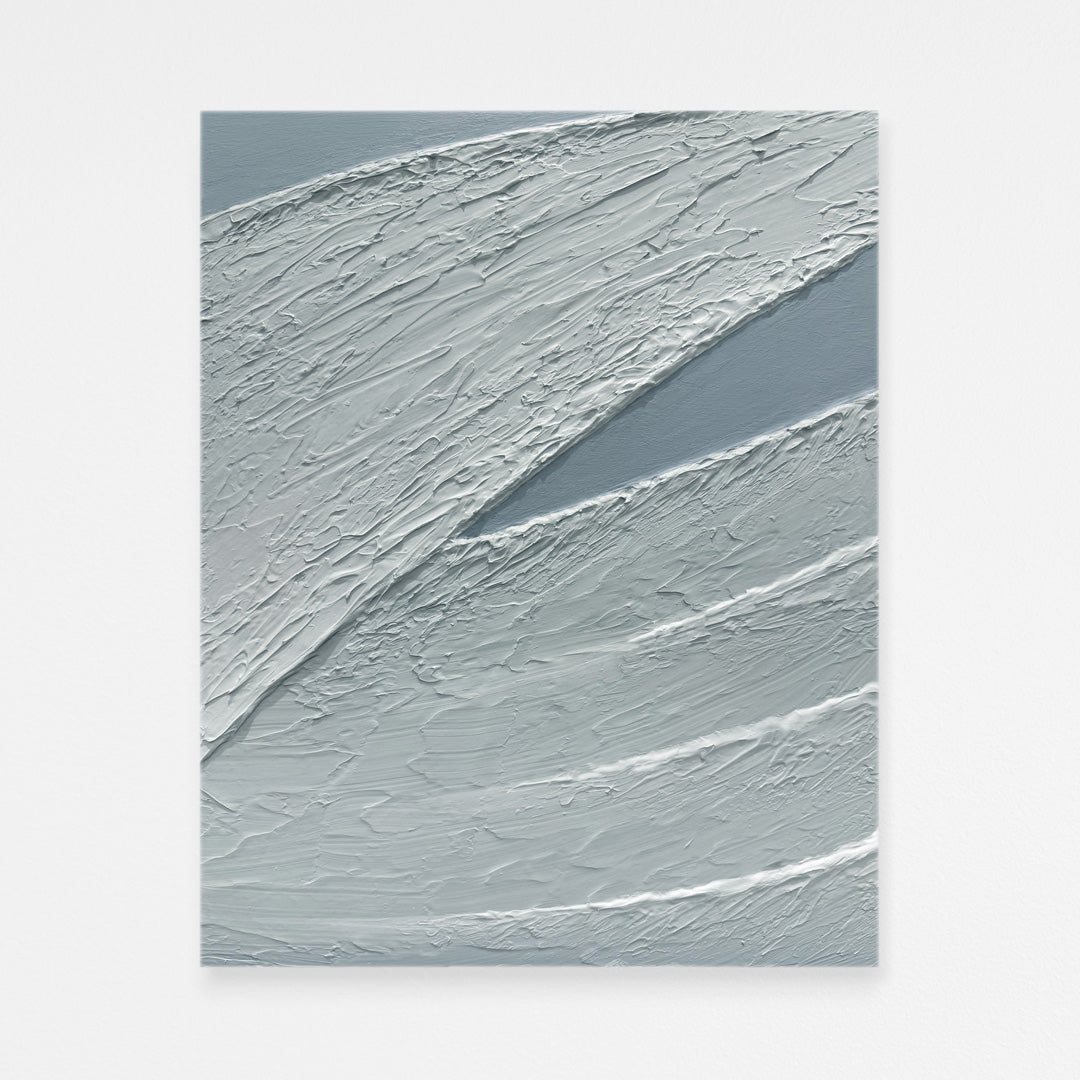 Textured acrylic blue ocean wave wall art on a white background