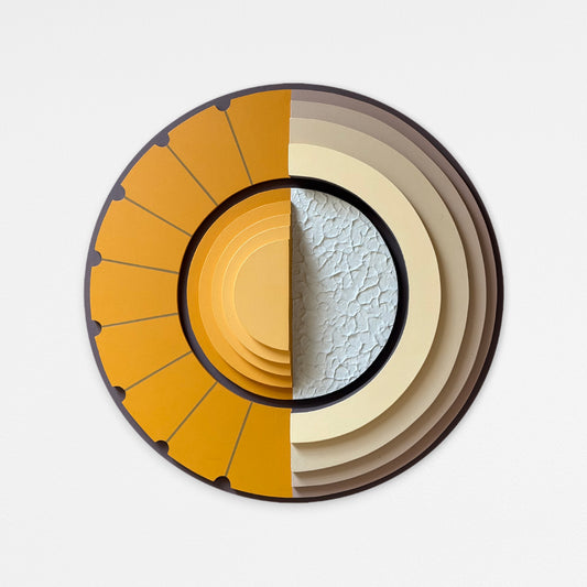 A circular abstract wood wall art piece with layered geometric segments in mustard yellow, beige, brown, and a textured light gray center, shown against a plain light background.