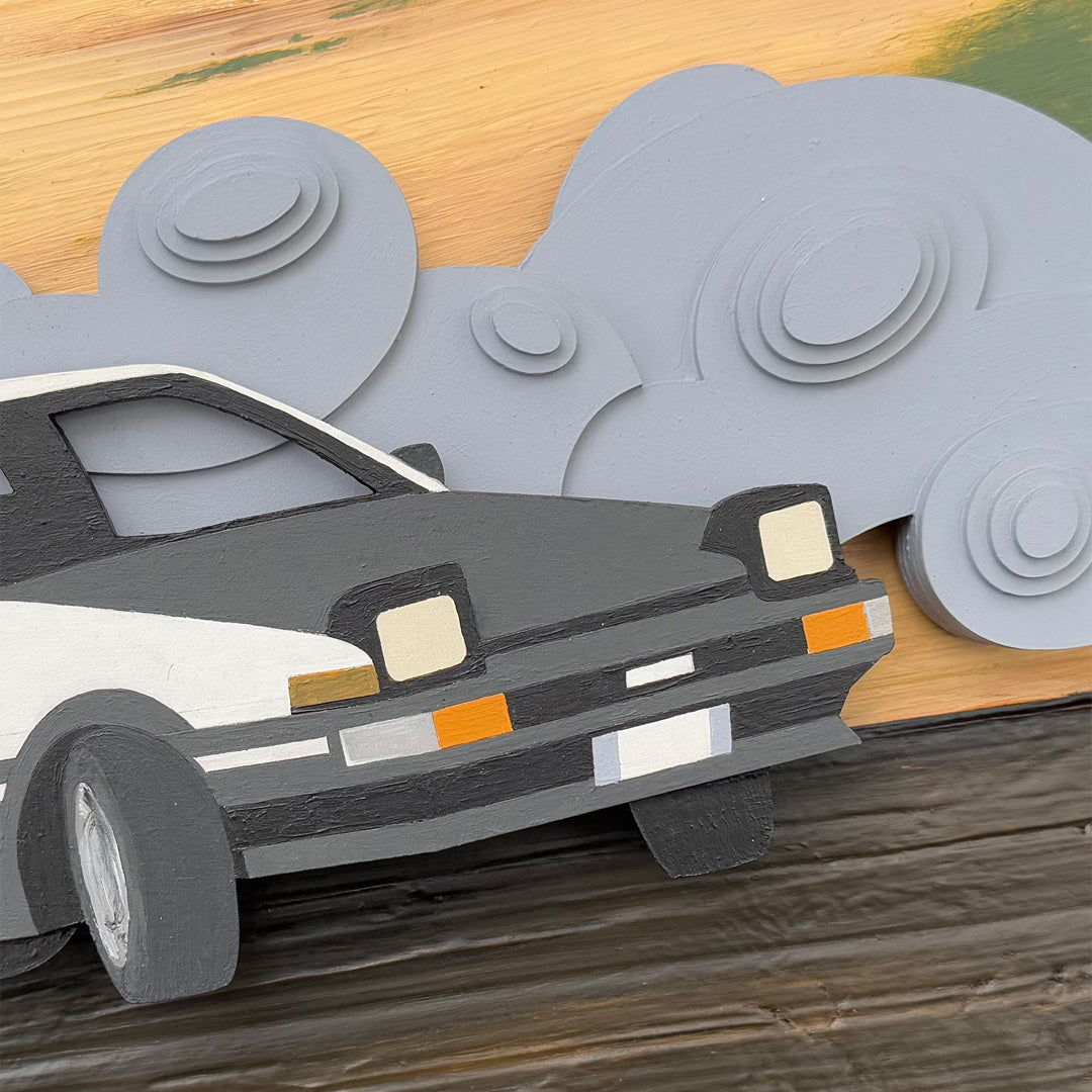 Close-up detailed photo of front of drifting car art with a scenic background of gray layered wood abstract smoke and textured racetrack.