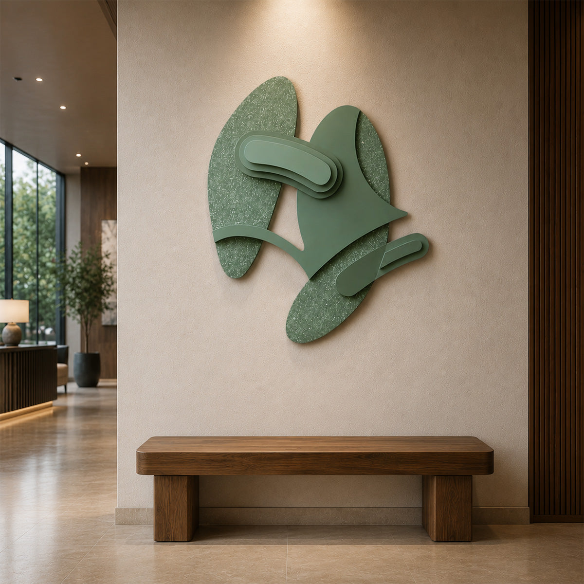 Abstract layered sage green wood wall sculpture displayed above a modern walnut bench in a warm, contemporary hotel lobby with textured plaster walls and minimalist interior design