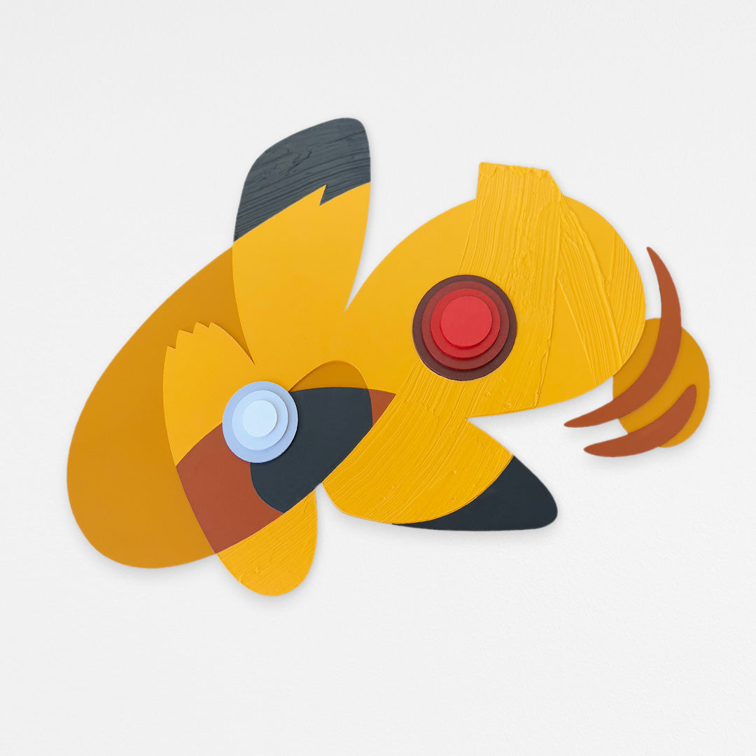 Handcrafted abstract pikachu wood wall sculpture with layered red geometric forms and textured yellow and black details. Hanging on a white wall.