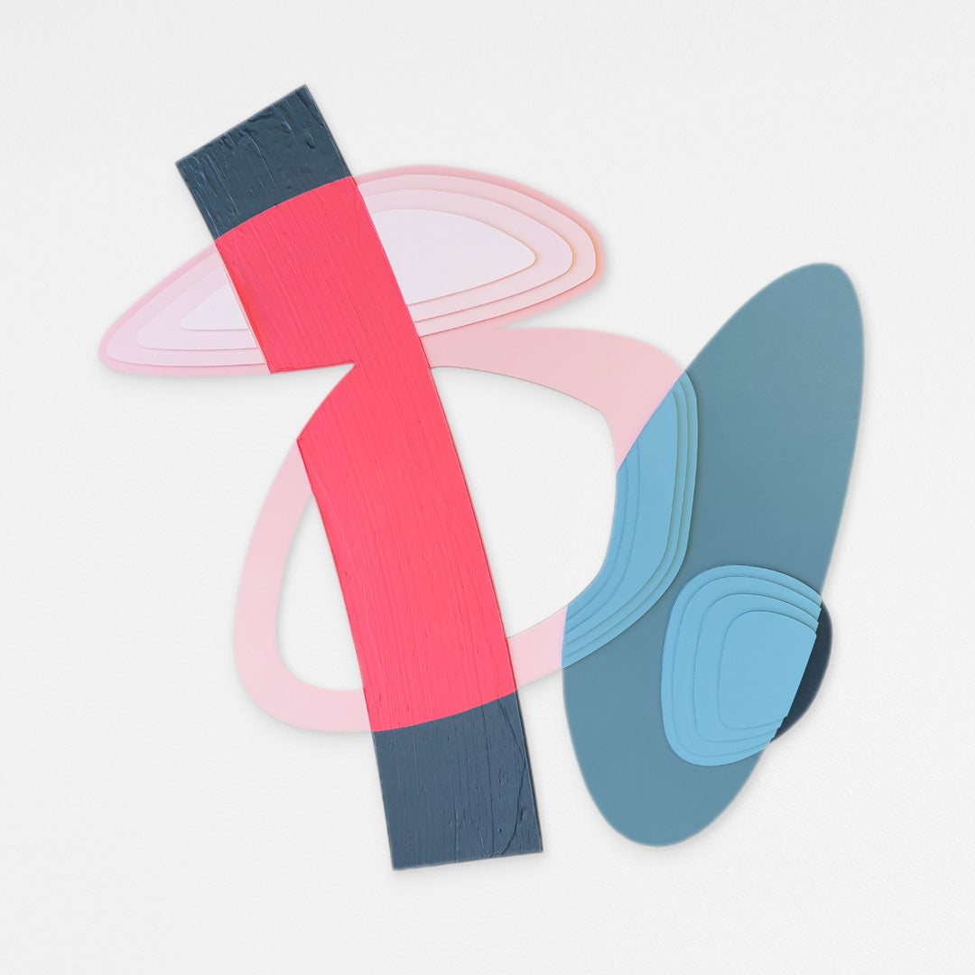 Handcrafted abstract wood wall sculpture with layered pink and blue geometric forms and a textured fluorescent pink strip. Hanging on a white wall.